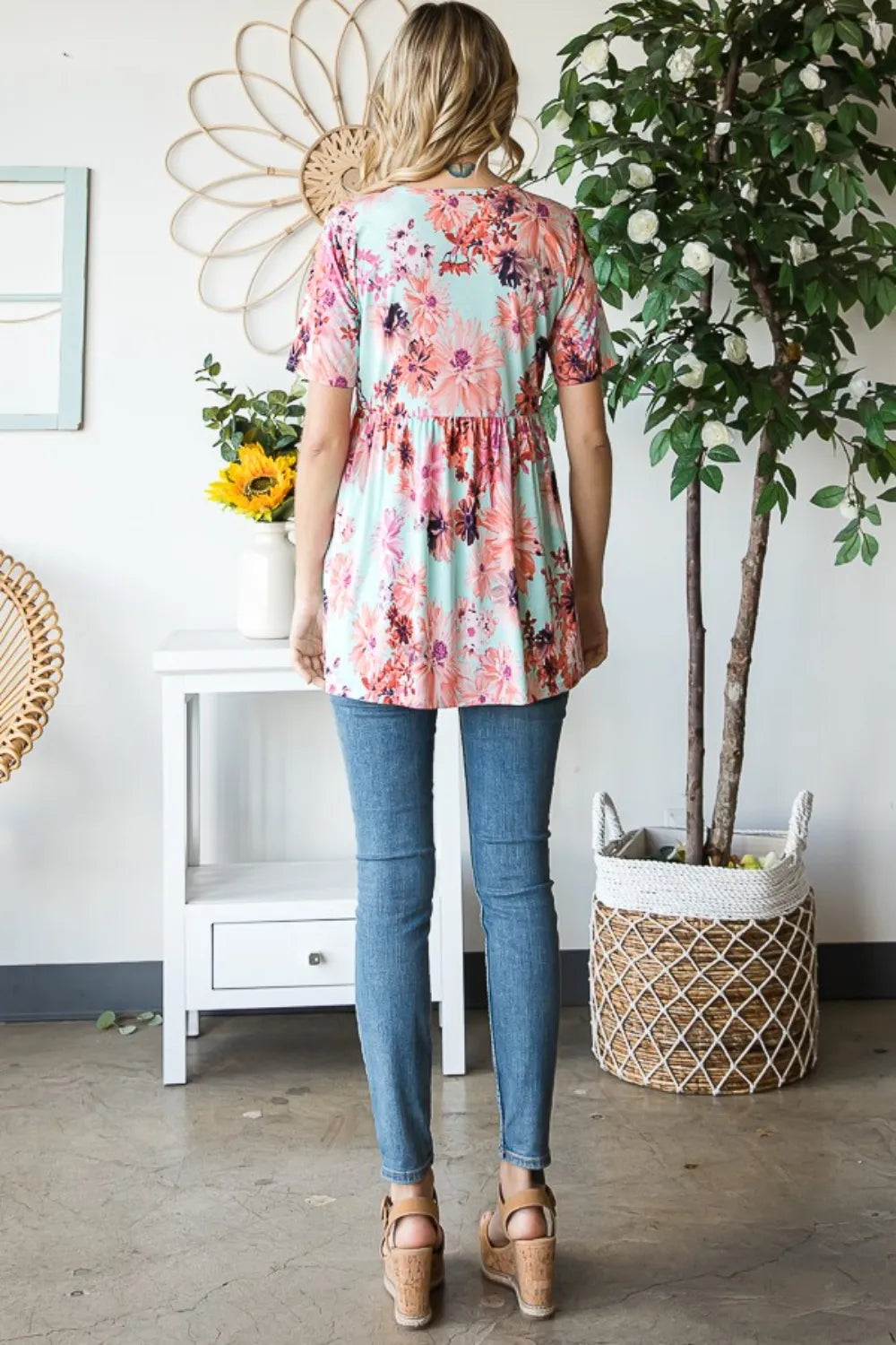 Heimish floral v-neck short sleeve babydoll blouse with feminine design, featuring a relaxed fit and delicate floral pattern.