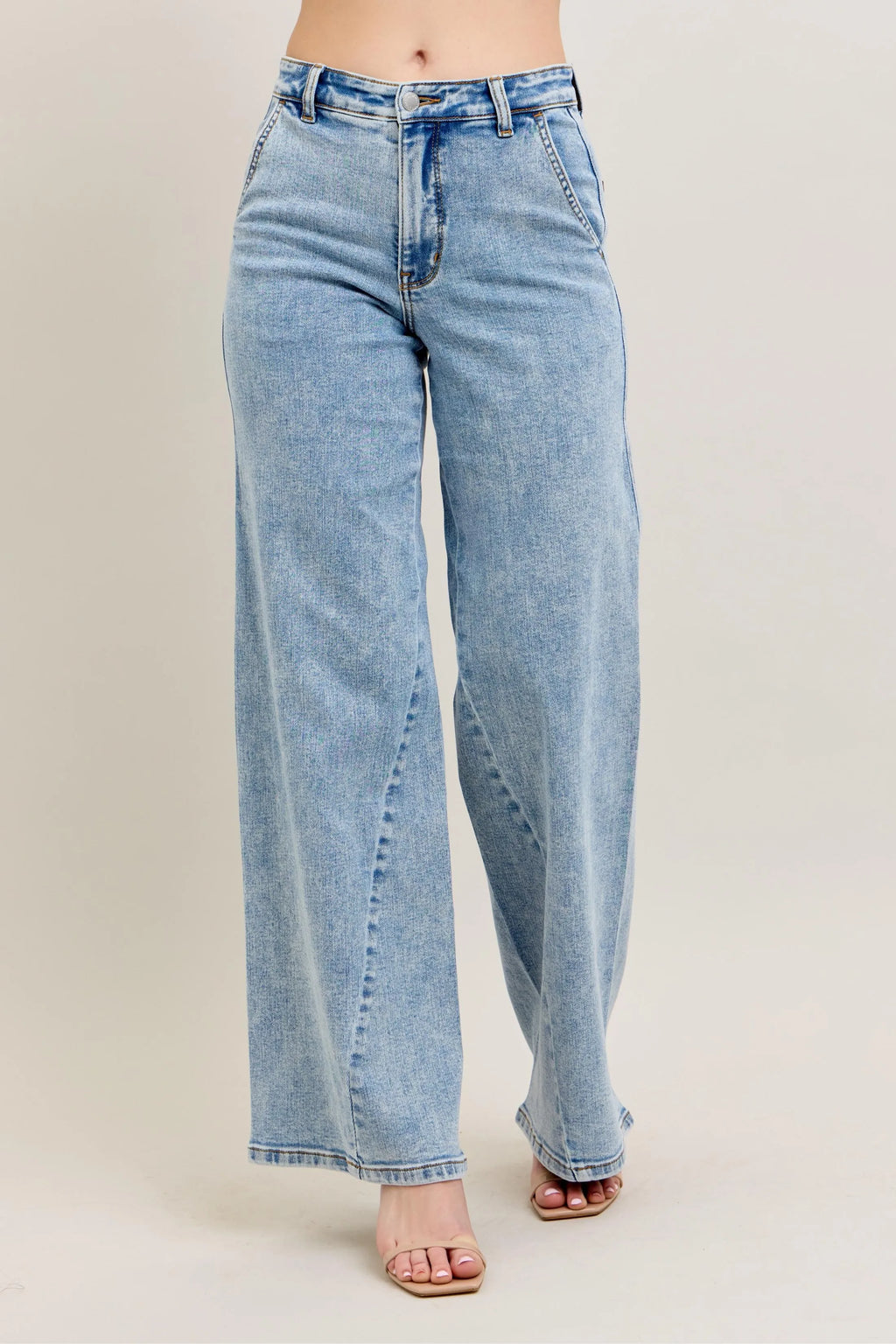 Plus size Judy Blue high waist wide leg jeans with skewed inseam, featuring a relaxed fit and stylish denim design.