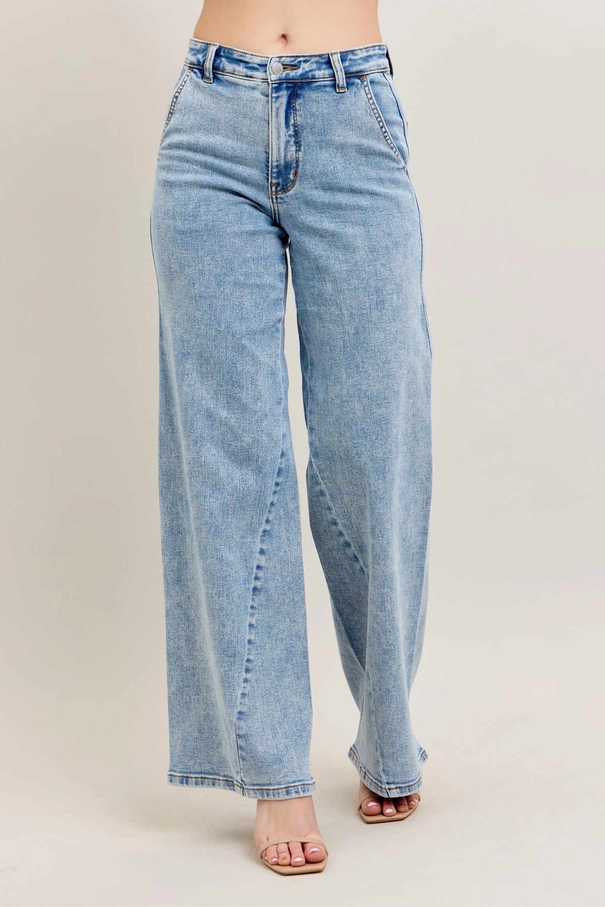 Plus size Judy Blue high waist wide leg jeans with skewed inseam, featuring a relaxed fit and stylish denim design.