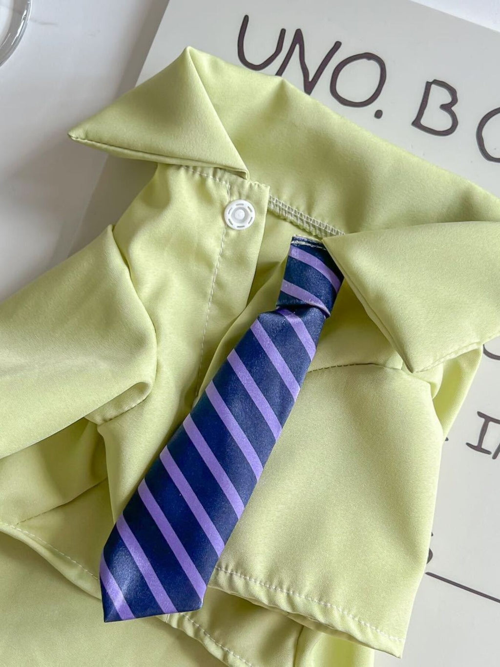Pet shirt with striped tie by Trendsi, featuring a stylish design, perfect for small dogs or cats, shown on a pet.