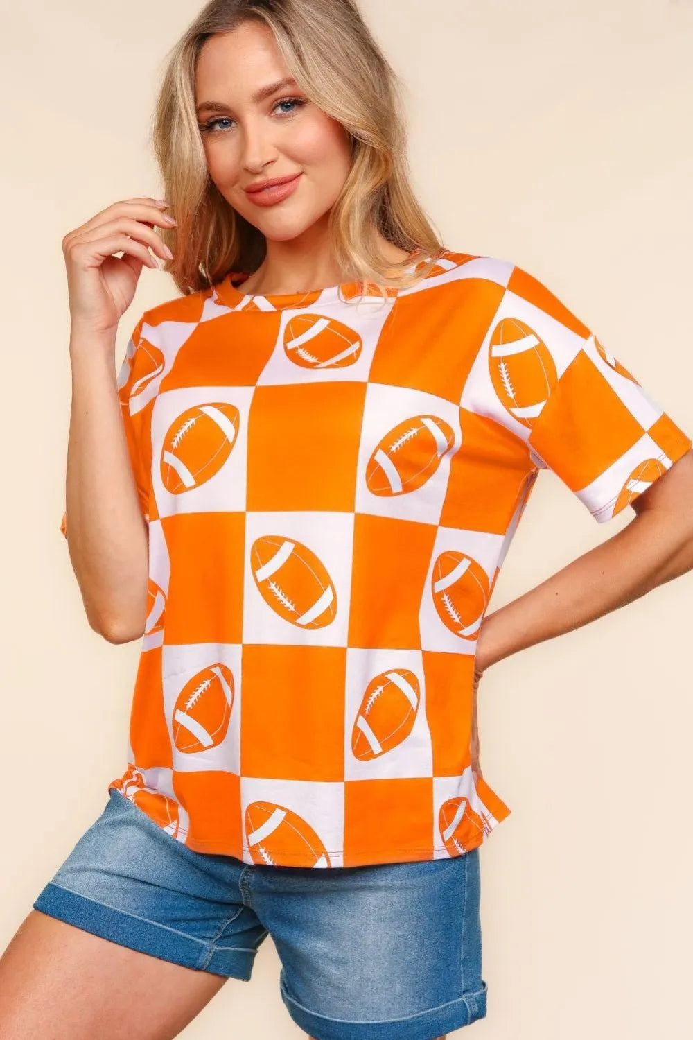 Checkered print Haptics football short sleeve T-shirt by Trendsi, featuring a sporty design and comfortable fit.