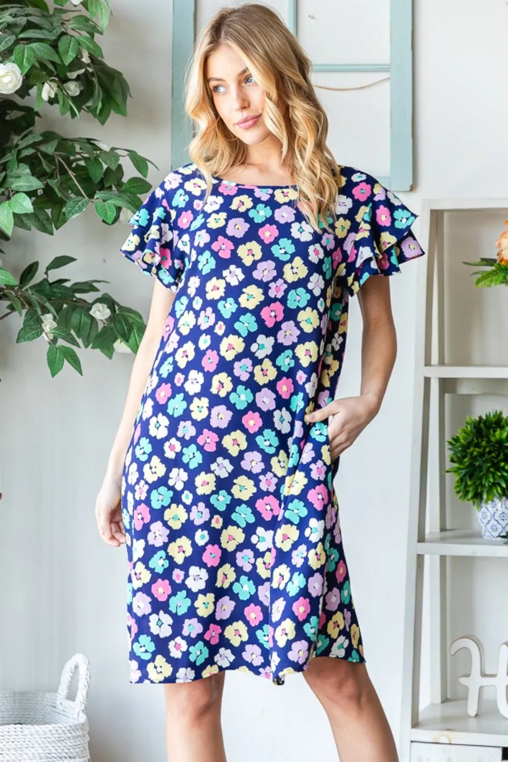 Heimish floral ruffled short sleeve dress with pockets, featuring a full-length design and a feminine, flowy silhouette.