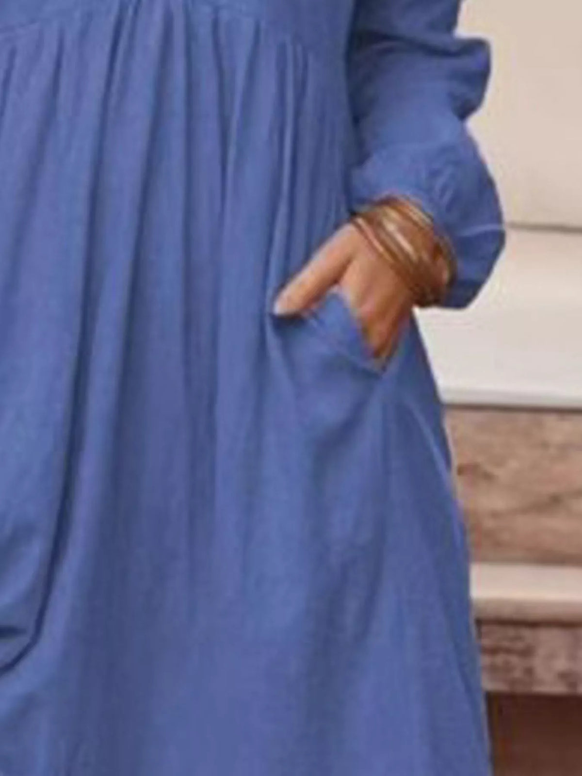 Full size V-neck long sleeve tiered maxi dress with pockets by Trendsi, featuring a flowing design and plus size fit.