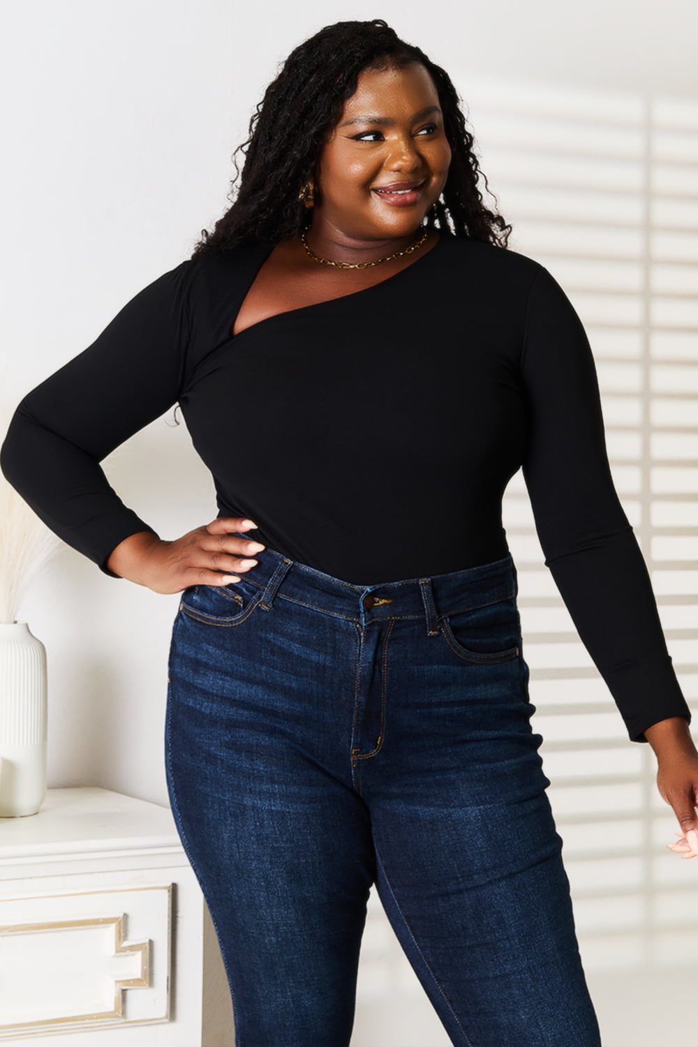 Basic Bae asymmetrical neck long sleeve top by Trendsi, featuring a stylish design with an asymmetrical neckline and fitted long sleeves.