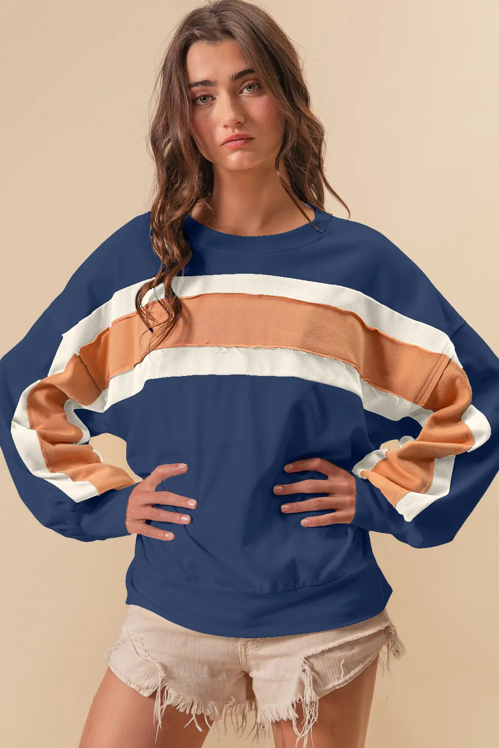 BiBi French Terry color block sweatshirt with cut edge detail in neutral tones, featuring a relaxed fit and stylish design.