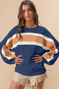 BiBi French Terry color block sweatshirt with cut edge detail in neutral tones, featuring a relaxed fit and stylish design.