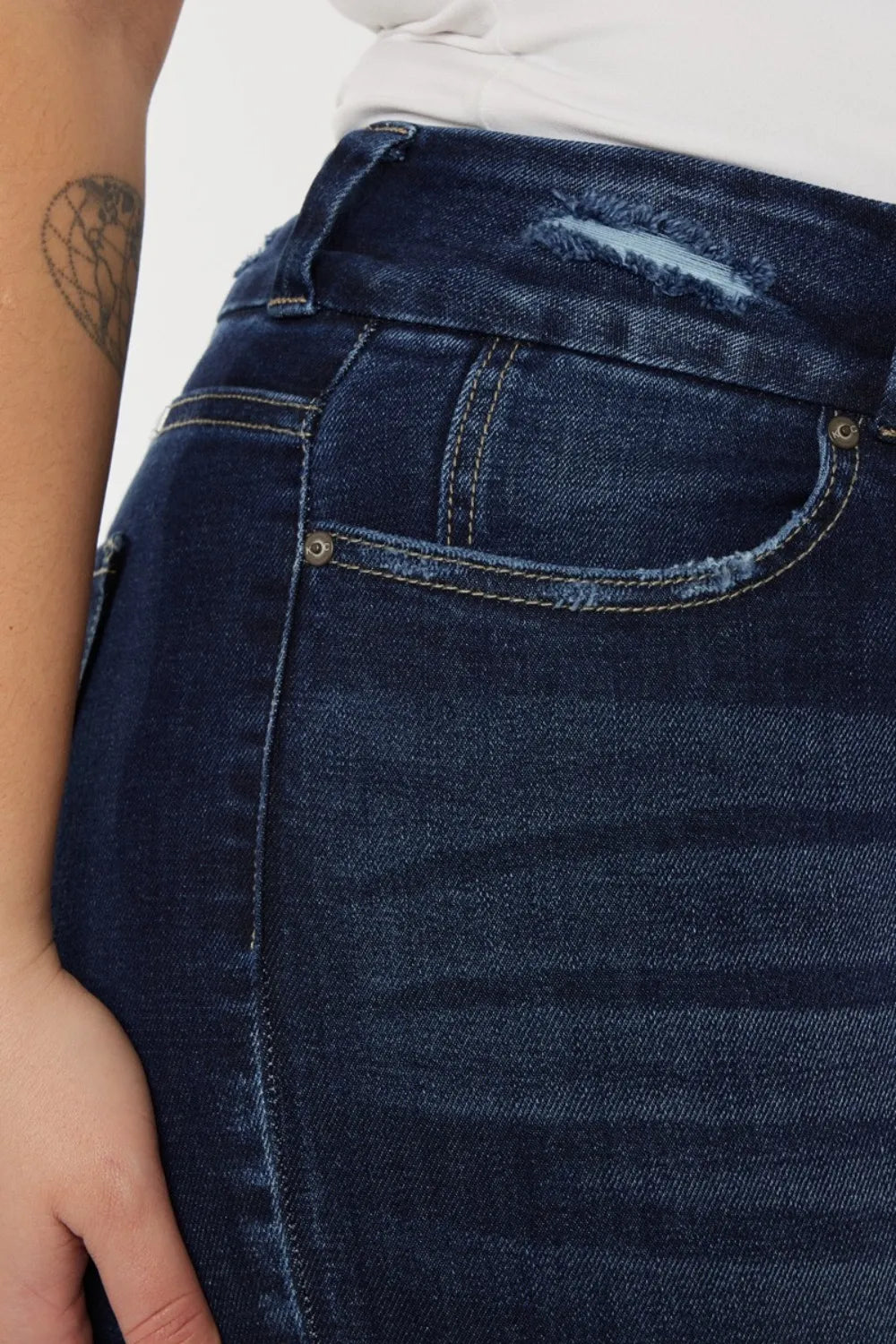 Kancan high waist jeans with raw hem and whisker details, styled for women, showcasing the full length and fit of the trendy denim.