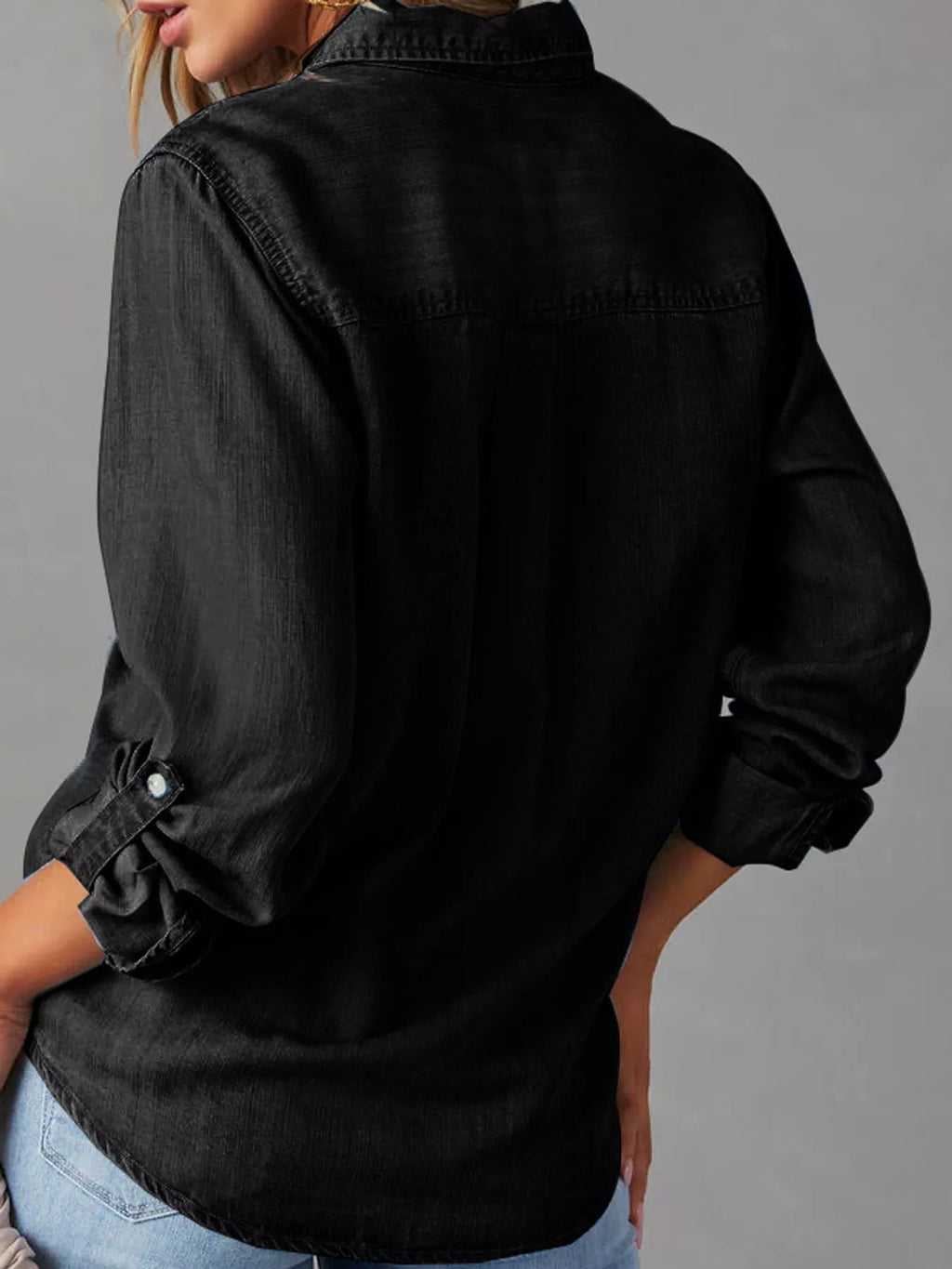 Classic button-down denim shirt by Trendsi featuring a full view of the blue denim fabric and collar detail.