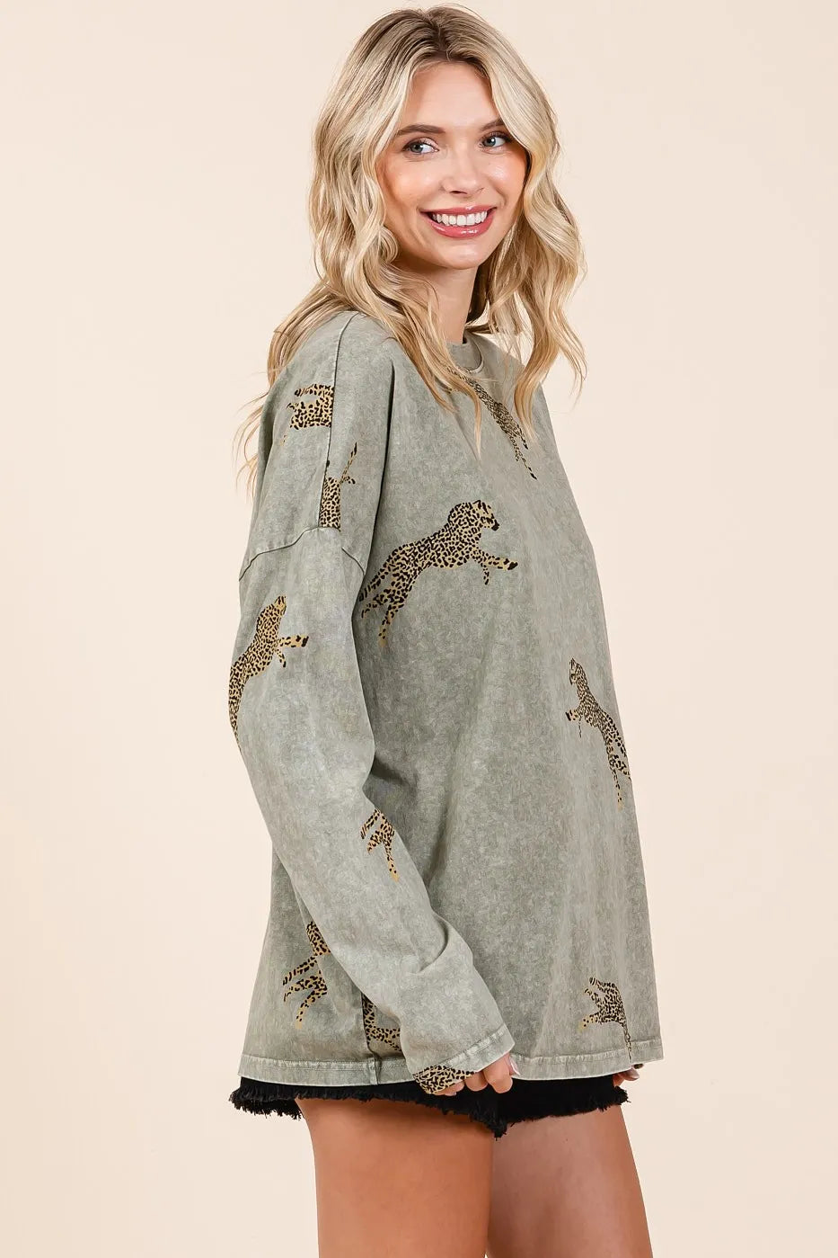 Mineroshop mineral wash cheetah print long sleeve top with relaxed fit, trendy animal print, and soft fabric for casual wear.