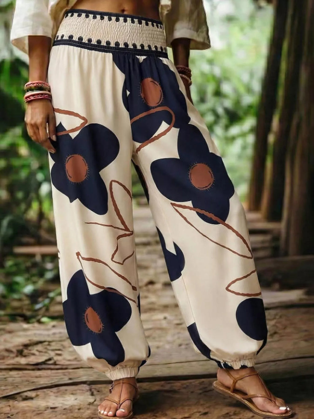Floral print wide-leg pants by Trendsi featuring a relaxed fit and vibrant floral design, perfect for casual or stylish outfits.