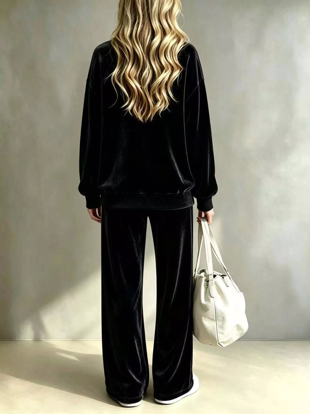 Plus size velvet dropped shoulder top and wide-leg pants set by Trendsi, featuring a stylish, comfortable fit and luxurious fabric.