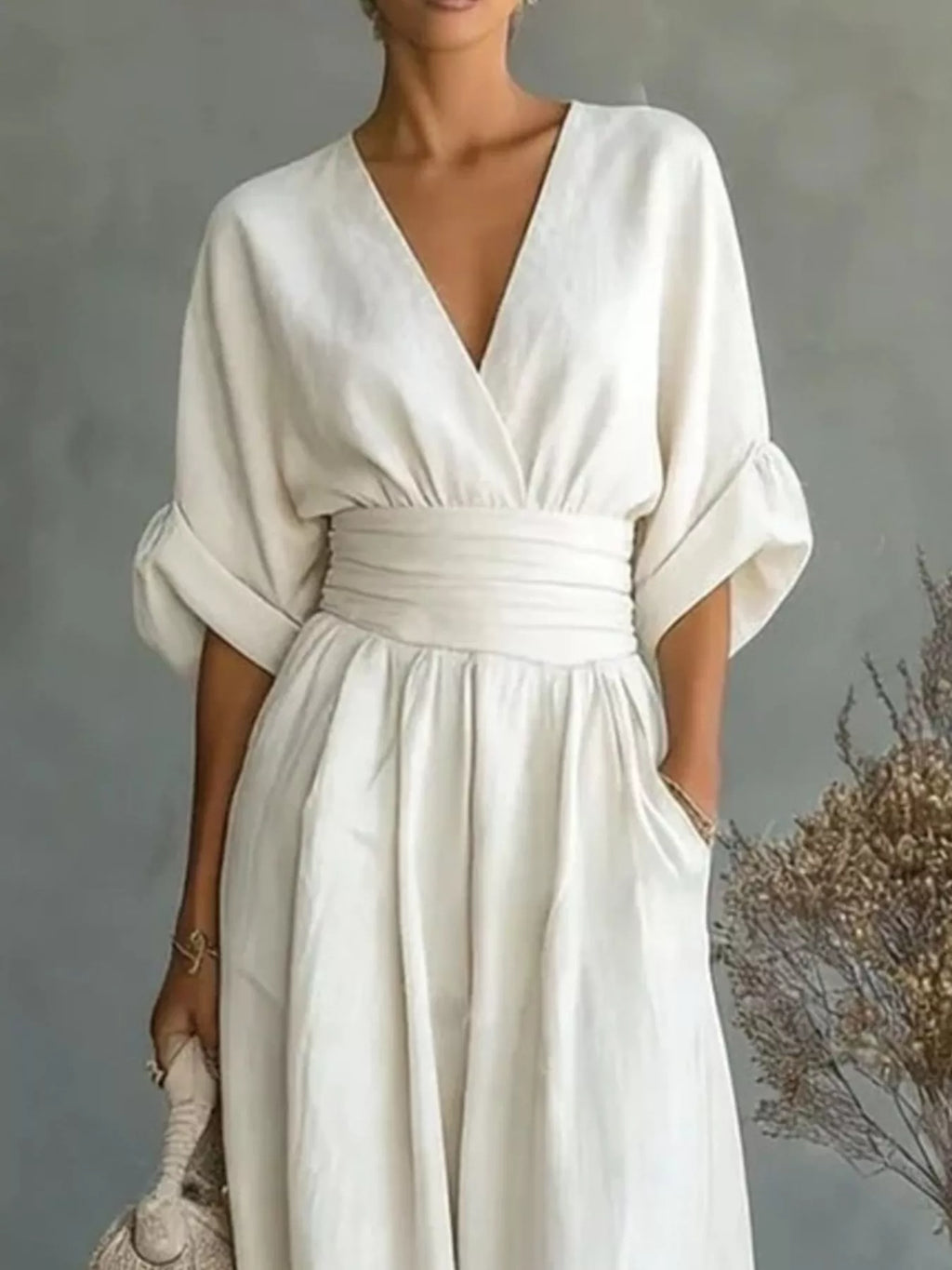 Plus size wide leg jumpsuit with half sleeves, full length, featuring a stylish, comfortable design from Trendsi.