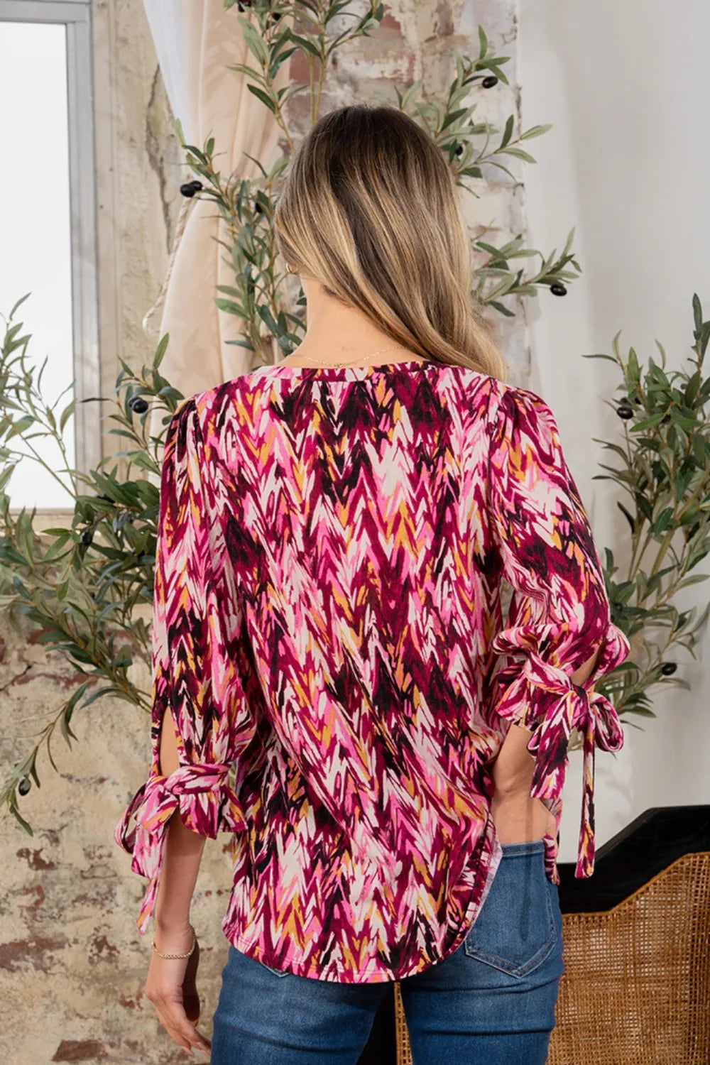 Printed V-neck blouse with sleeve knot detail from Sew In Love by Trendsi, shown in full size on a model.