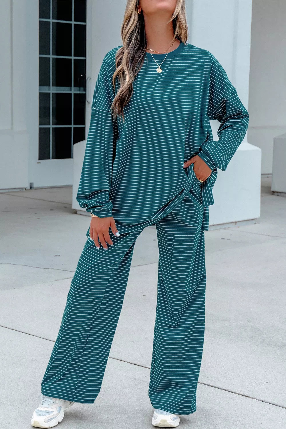 Stripe dropped shoulder long sleeve top and elastic waist pants casual 2-piece set by Trendsi, featuring relaxed fit and comfortable fabric.