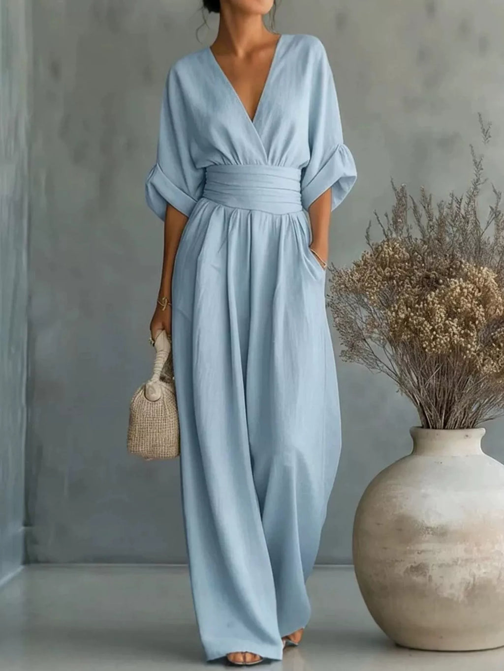 Plus size full length jumpsuit by Trendsi with half sleeves and wide-leg design, shown in a stylish, comfortable fit.