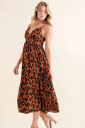 Leopard print plunge maxi dress from Trendsi featuring a fitted waist and flowing skirt for a bold, stylish look.