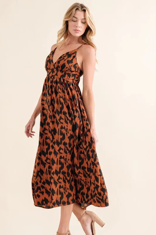 Leopard print plunge maxi dress from Trendsi featuring a fitted waist and flowing skirt for a bold, stylish look.