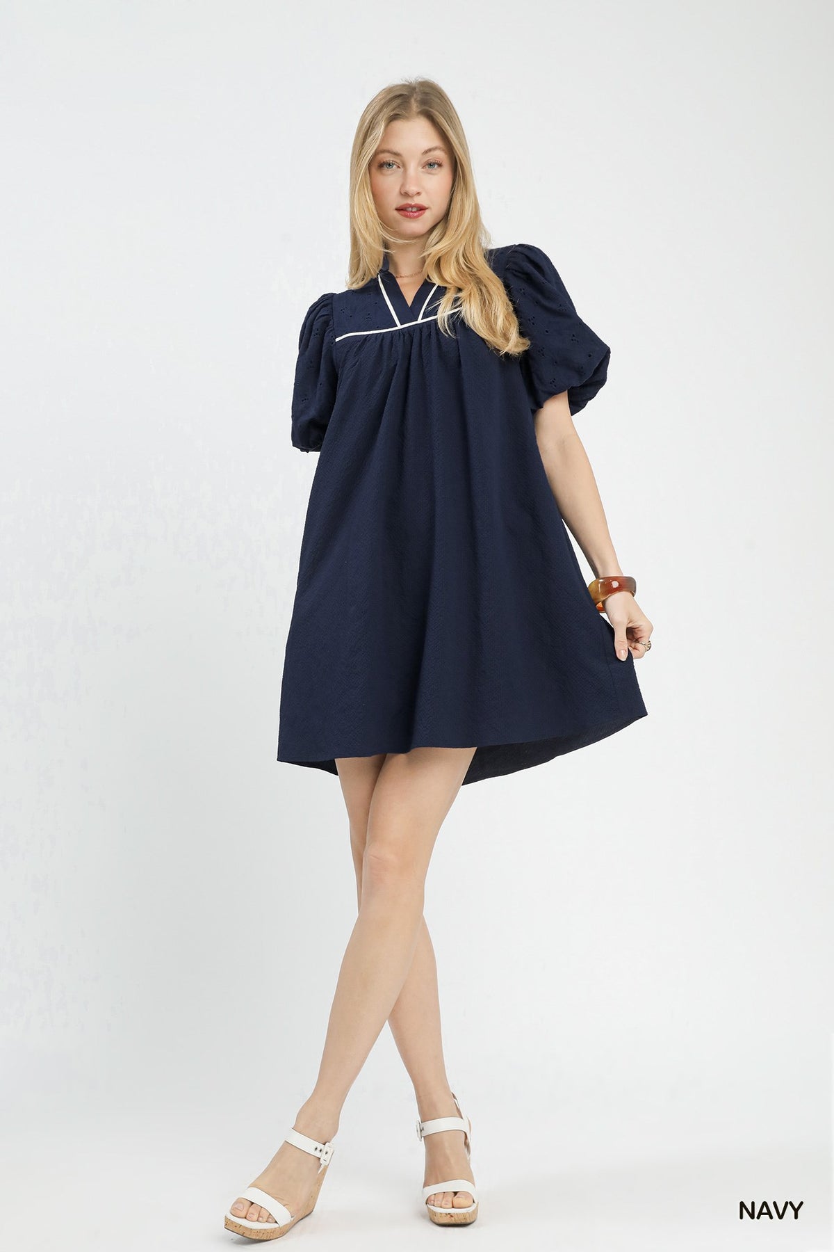 Umgee puff sleeve textured babydoll dress featuring a flowy silhouette and feminine style, perfect for casual or semi-formal wear.