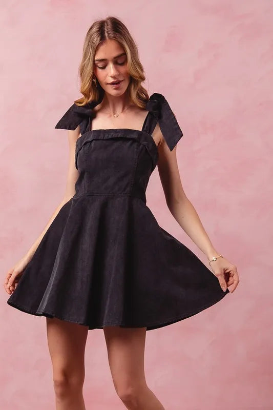 Trendsi SO ME Fit and Flare Washed Gameday Dress displayed on a hanger, featuring a casual flared silhouette and washed denim look.