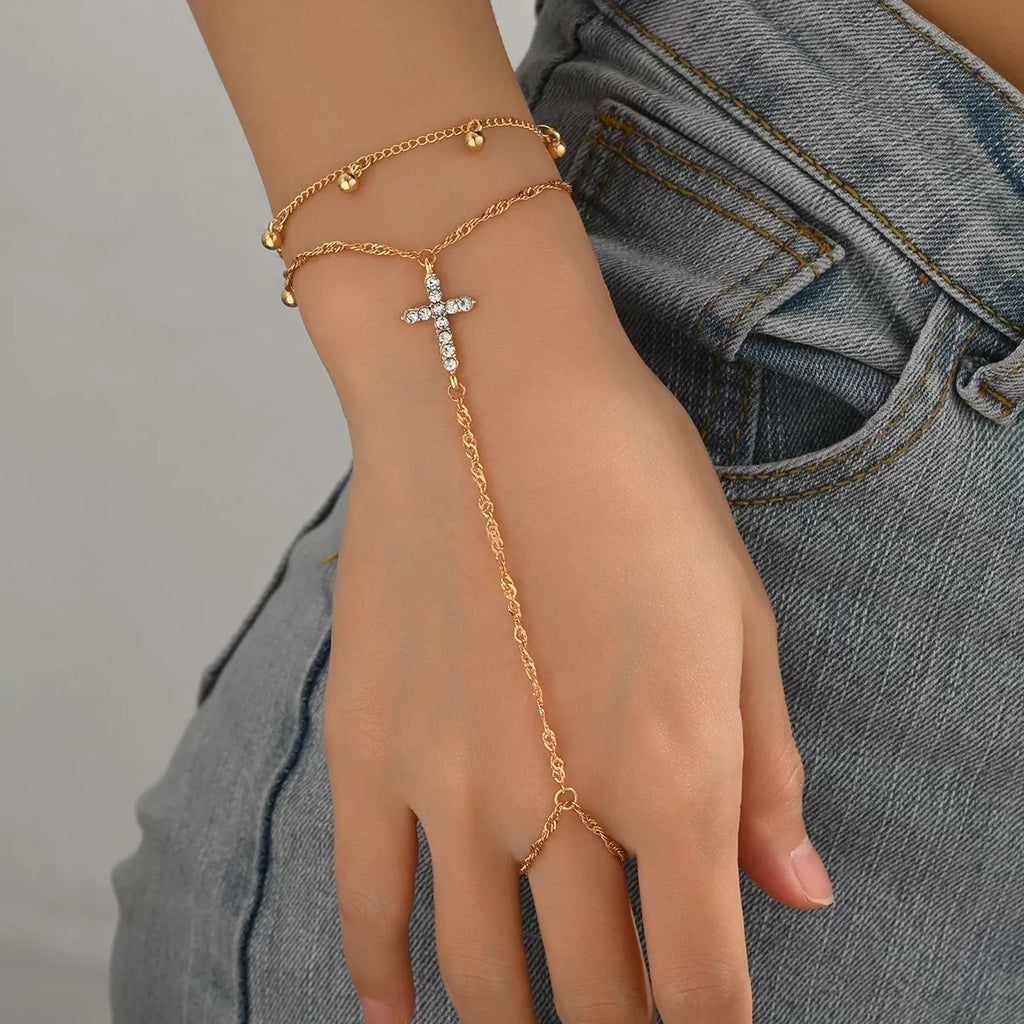 18K gold-plated chain cross bracelet with delicate design, featuring a stylish cross pendant on a sleek chain.