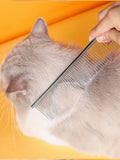 Stainless steel pet grooming comb for hair removal with fine and wide teeth, designed for effective pet hair grooming.