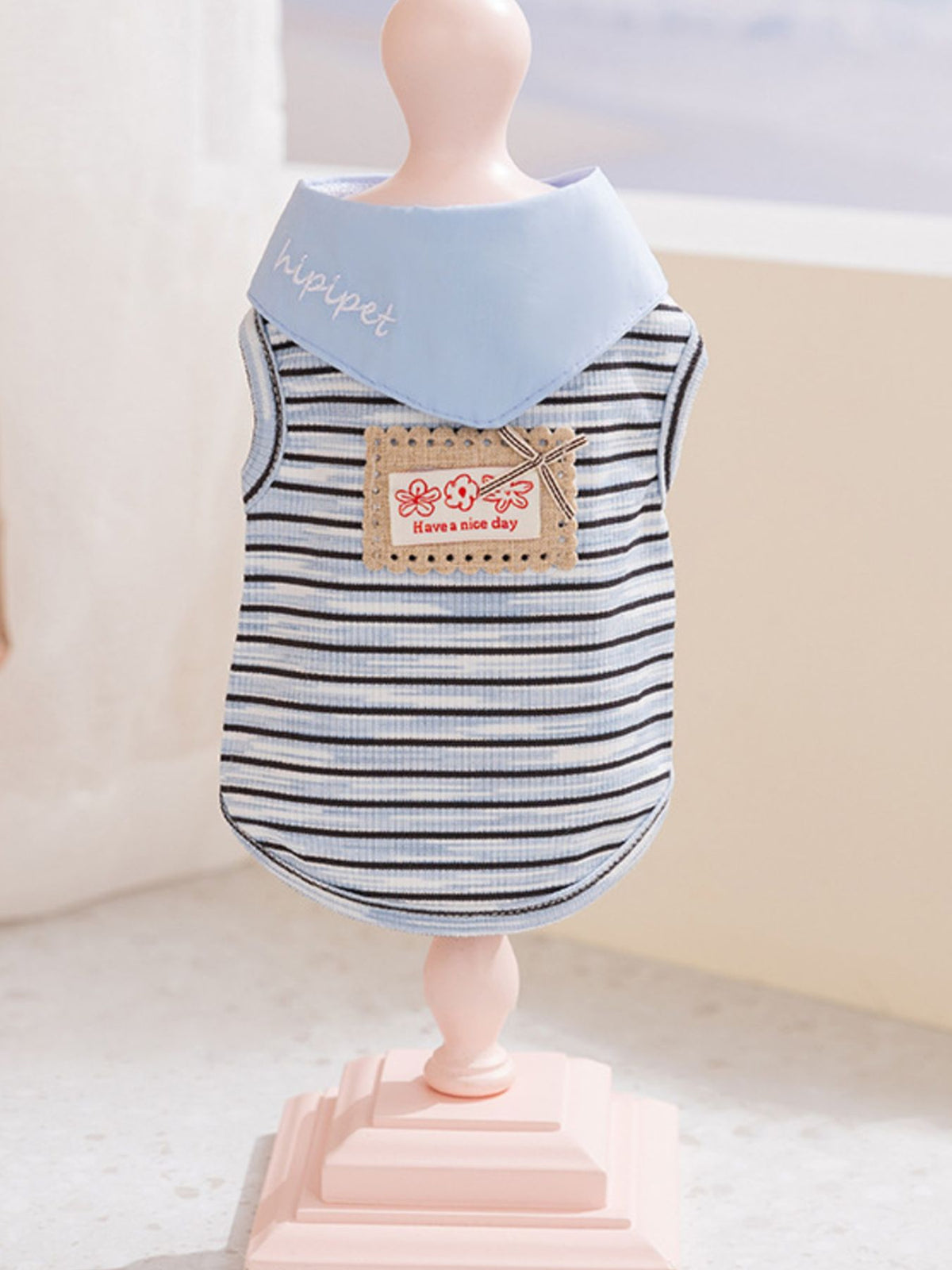 Striped tied pet top by Trendsi featuring adjustable straps and colorful pattern, perfect for stylish pet outfits.