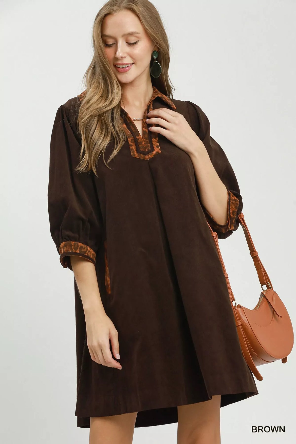 Umgee V-neck shift dress with contrast trim, showcasing a stylish casual dress with a relaxed fit and detailed neckline.