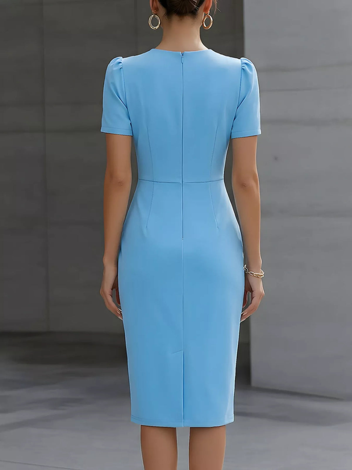Ruched short sleeve midi dress from Trendsi featuring a fitted design and soft fabric, ideal for casual or semi-formal wear.
