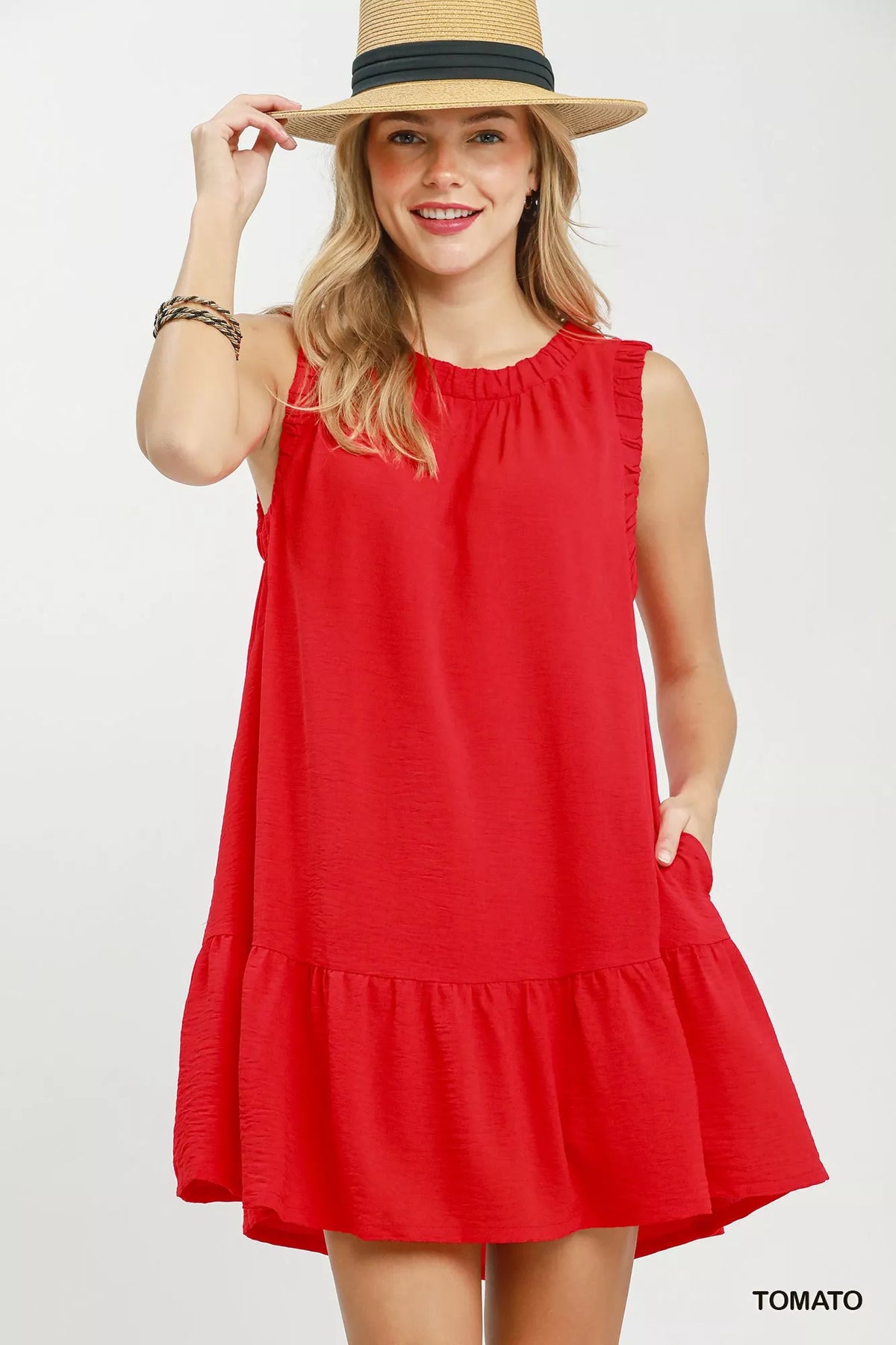 Umgee sleeveless drop waist mini dress with ruffle trim, perfect for casual summer wear, shown in a stylish floral pattern.