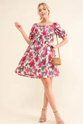Smocked floral ruffle mini dress with short sleeves from Trendsi, featuring a feminine and stylish design.