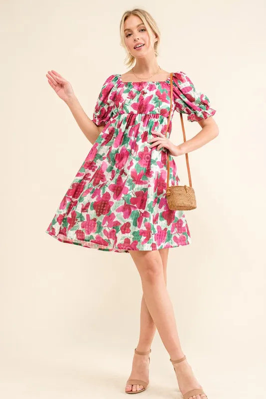Smocked floral ruffle mini dress with short sleeves from Trendsi, featuring a feminine and stylish design.