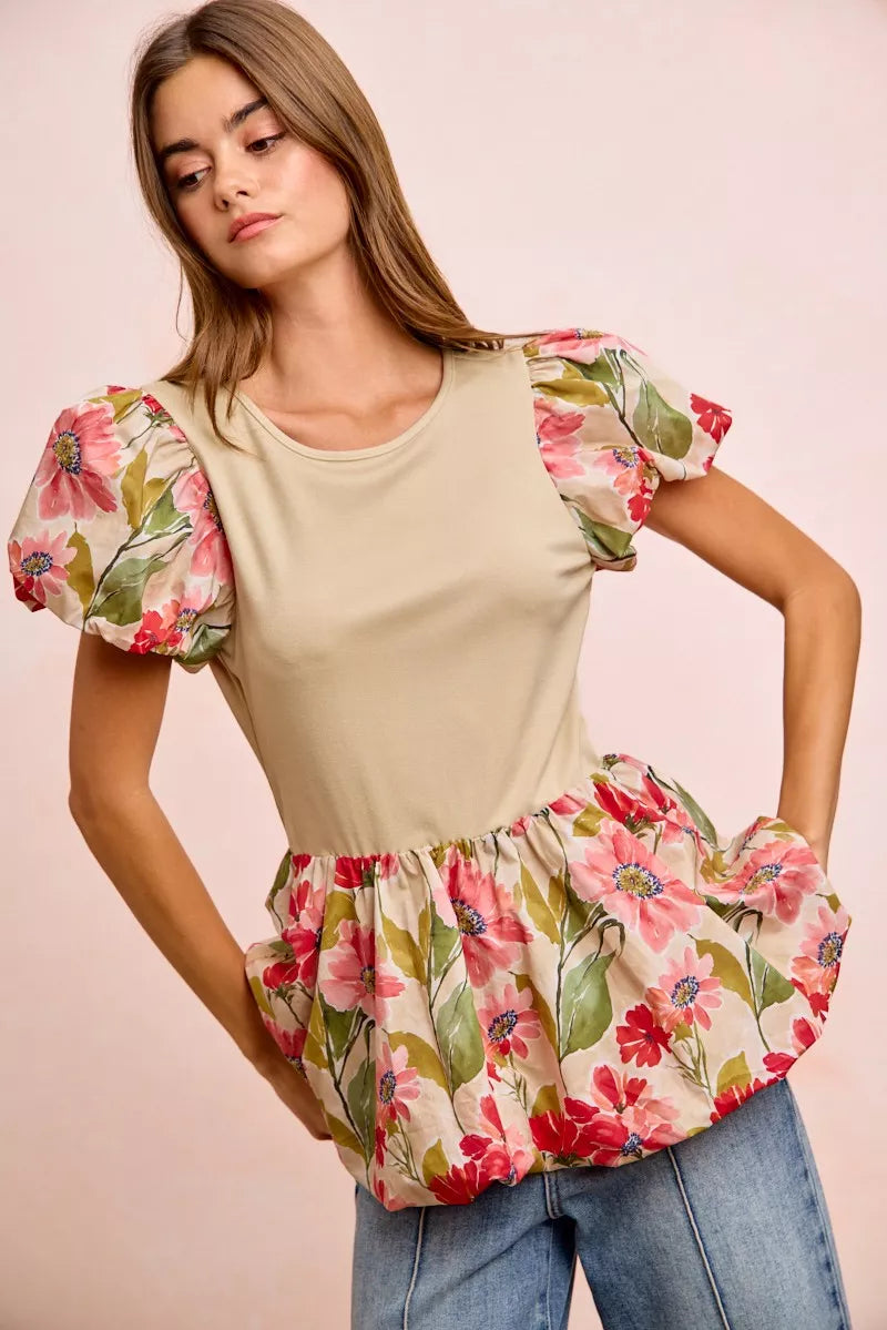 Floral printed bubble sleeve peplum top by Trendsi with ruffled hem and vibrant flower design on lightweight fabric