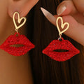Gold-plated rhinestone lips and heart dangle earrings with a trendy design, perfect for stylish accessories.