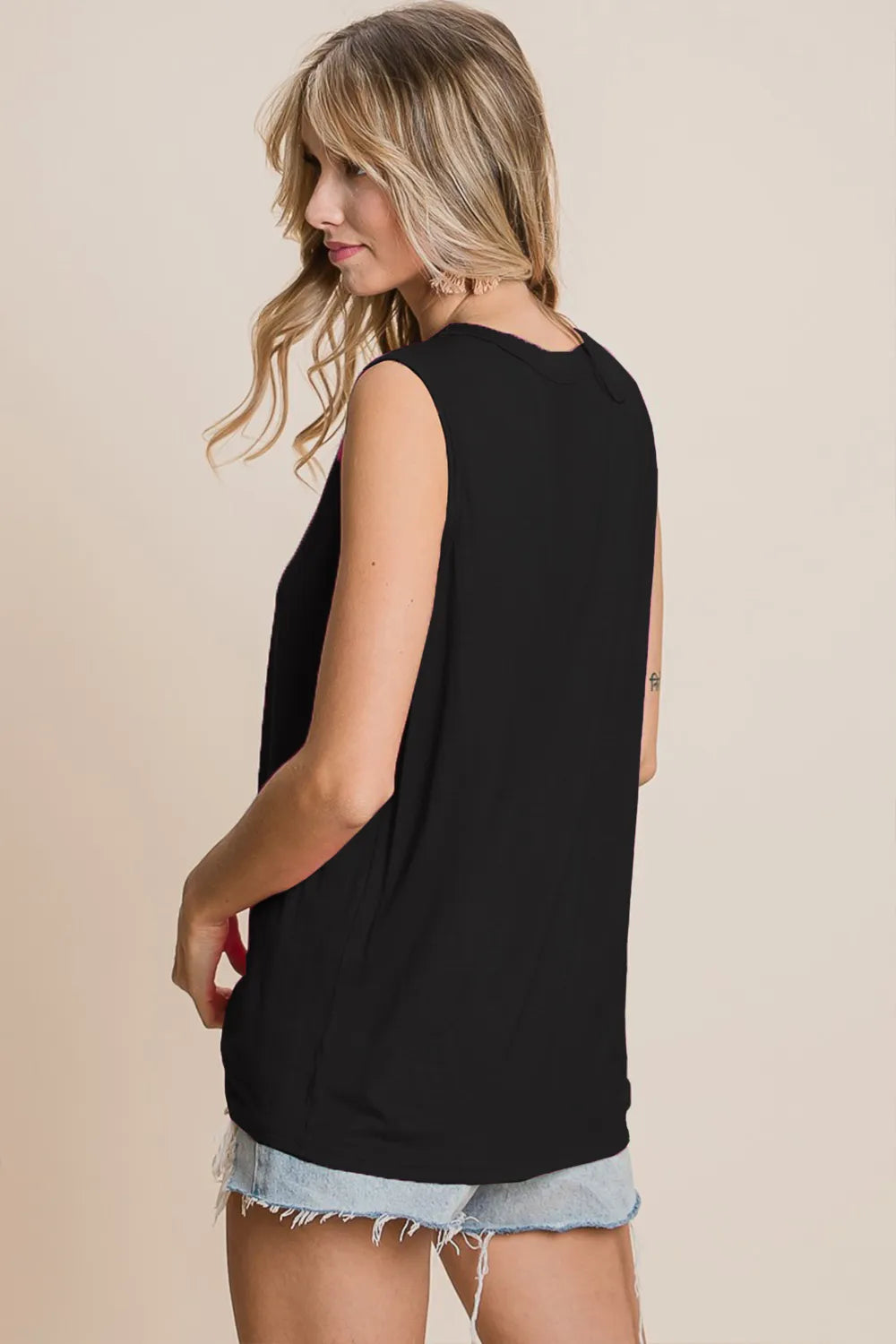 Sleeveless BiBi cutout round neck top by Trendsi, featuring a stylish design with cutout details and a classic round neckline.