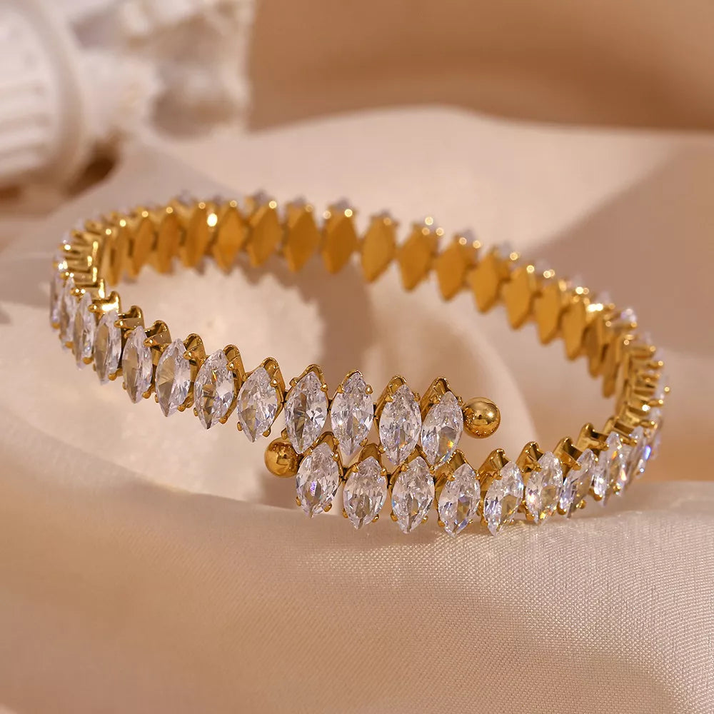 18K gold-plated zircon bracelet and ring jewelry set featuring sparkling zircon stones on elegant jewelry pieces