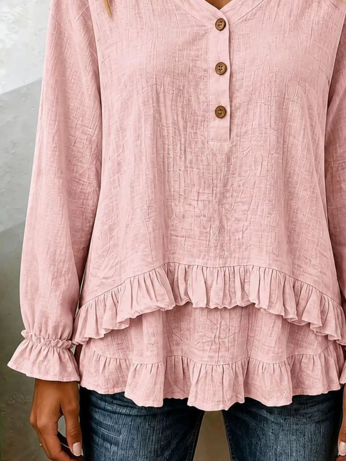 Long sleeve blouse with ruffled hem from Trendsi, featuring a stylish design and soft fabric, shown in the product image.