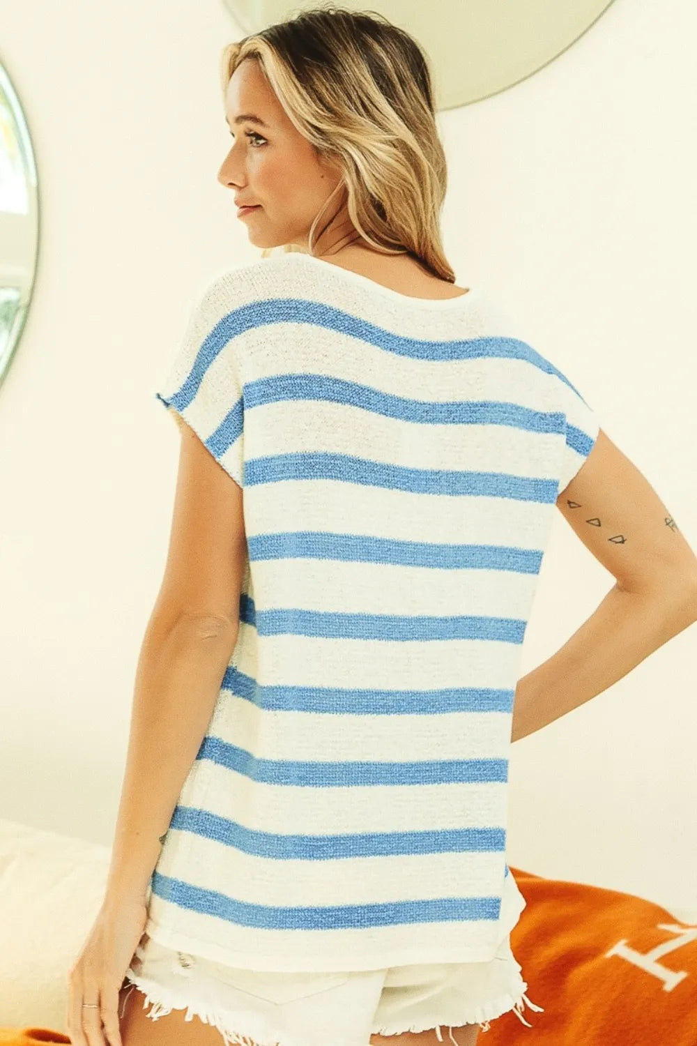 BiBi striped round neck short sleeve knit top by Trendsi, featuring a casual fit and colorful horizontal stripe pattern.