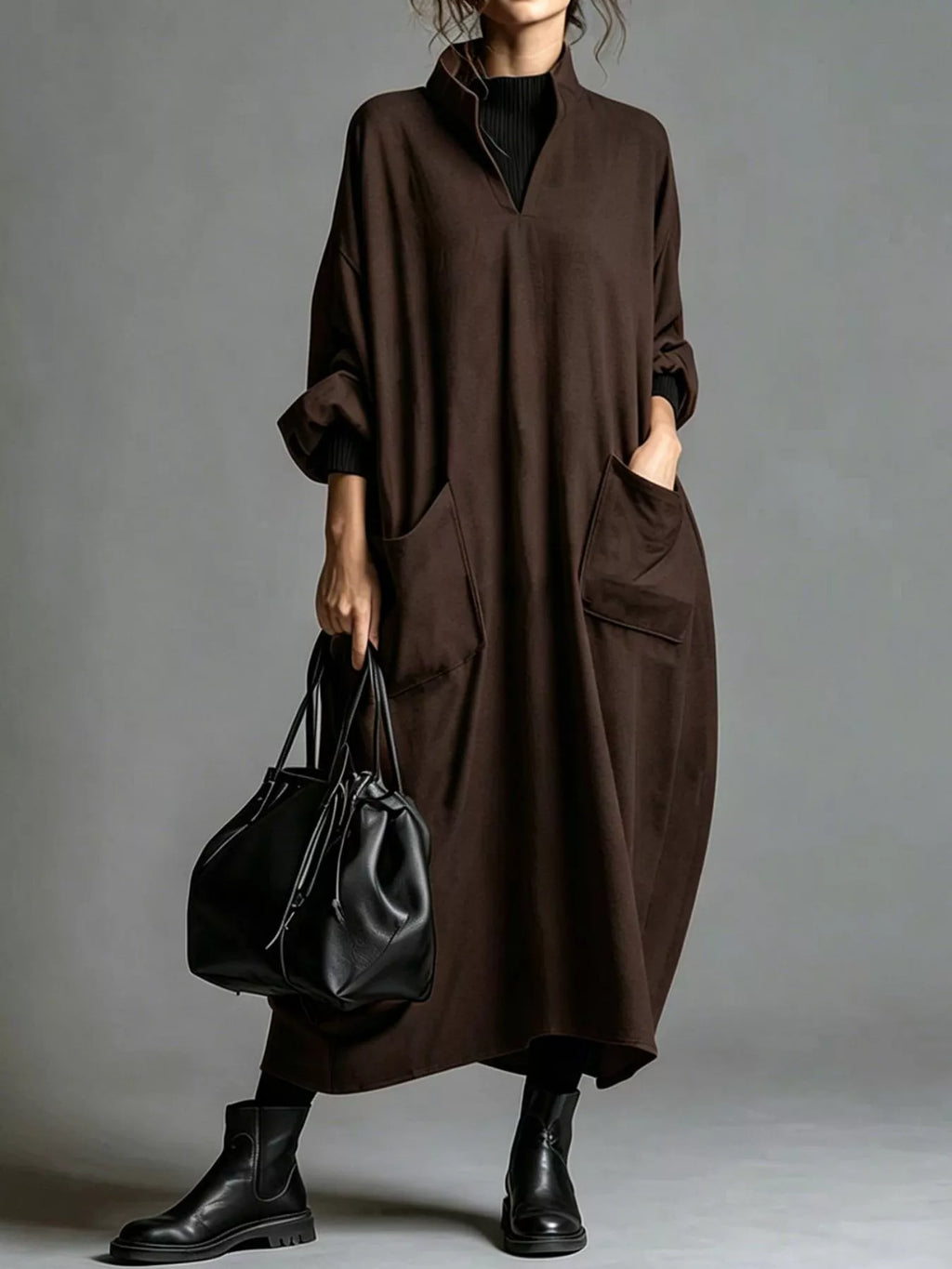 Plus size loose-fit mock neck midi dress with pockets by Trendsi, shown in full length with a relaxed silhouette and neutral fabric.