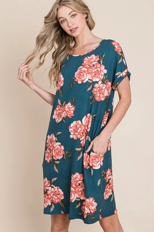 Trendsi BOMBOM floral round neck short tee dress with pockets, featuring a colorful floral pattern and casual fit.
