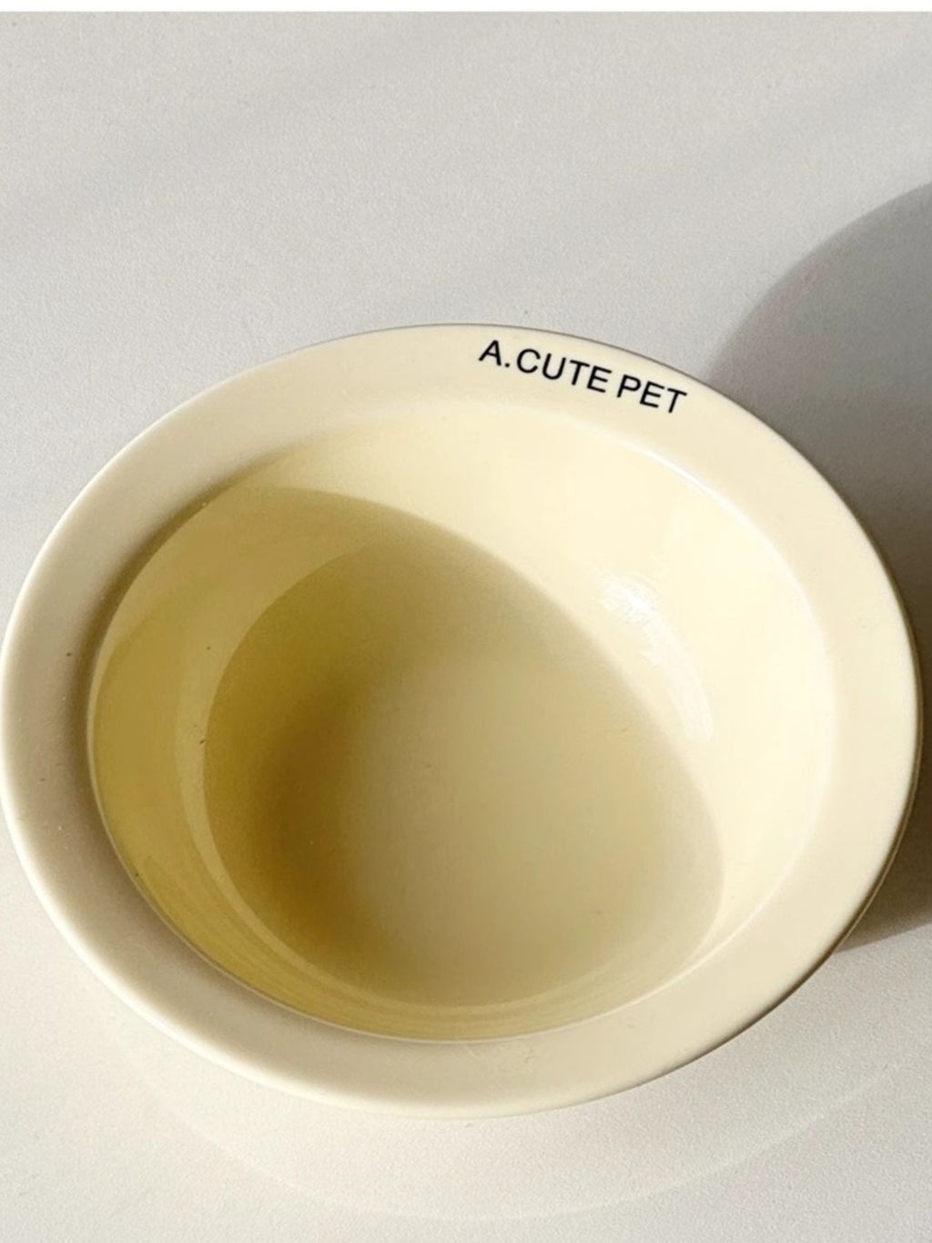 Ceramic pet bowl by Trendsi with a simple design, featuring a rounded shape and smooth surface for feeding cats or small dogs.