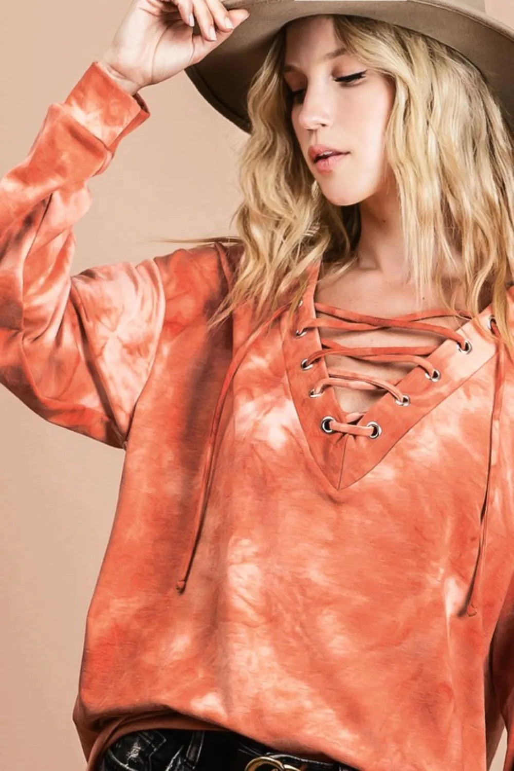 BiBi lace-up tie-dye French terry long sleeve top by Trendsi, featuring a casual relaxed fit and vibrant tie-dye pattern.